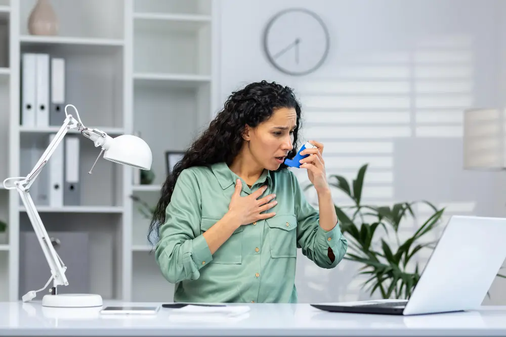 women using inhaler to prevent shortness of breath
