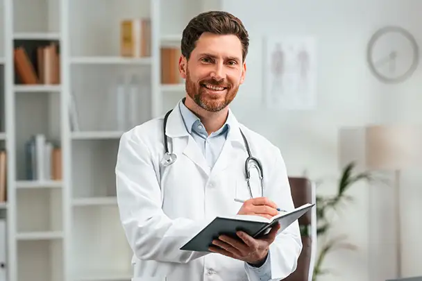 Professional male doctor showing a medical report while providing care near Bloomingdale.