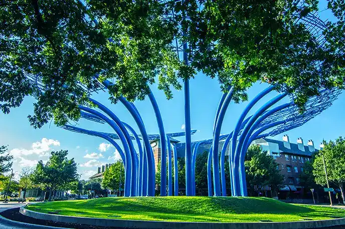 Blue modern sculpture landmark in Addison, IL, for Swan Primary Care services.