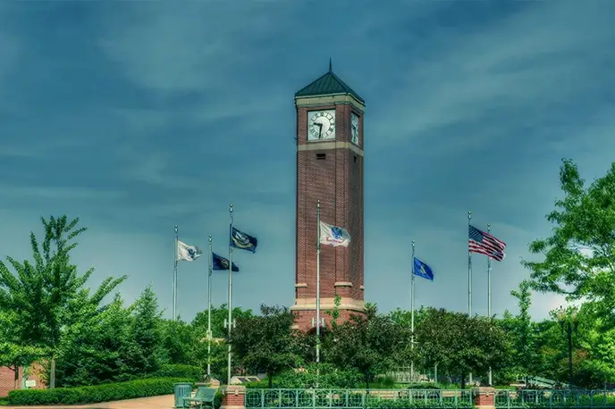 Schaumburg clock tower displaying the Swan Primary Care medical group location.